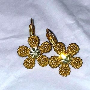 Authentic Kate Spade gold daisy earrings with crystal center.